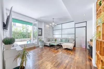 a living room with a couch and a table at Peaceful Haven, Terrace in Nice in Nice