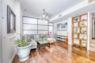 a living room with a couch and a table at Peaceful Haven, Terrace in Nice in Nice