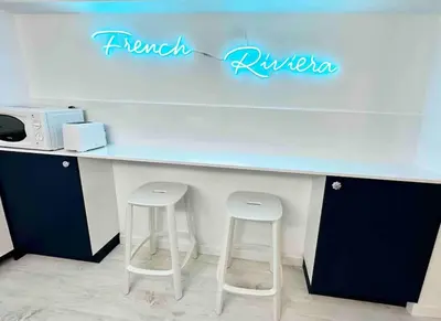 a counter with two stools in a room at Nouveau - Nice Mamac - centre in Nice