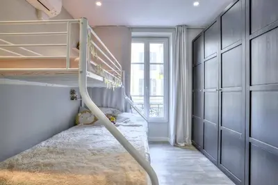 a bedroom with a bunk bed and a staircase at La Maison Hélène & Antoine Nice Le Port in Nice