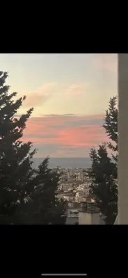 a view of a city with buildings and trees at Magnifique appartement Bas Gairaut aperçu mer in Nice