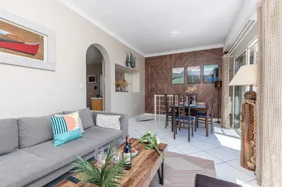 a living room with a couch and a table at VILLA CRUG HYWEL - VILLEFRANCHE-SUR-MER in Villefranche-sur-Mer
