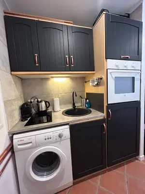a kitchen with a washing machine and a sink at Loft Place Massena in Nice