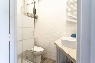 a bathroom with a toilet and a sink at #2 Central Studio top floor AC & Balcony in Nice