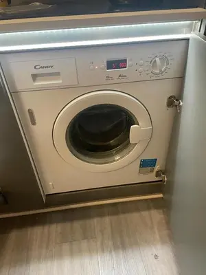 a washing machine with its door open in a kitchen at Magnifique studio carré d’or in Nice
