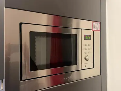 a stainless steel microwave oven in a kitchen at Magnifique studio carré d’or in Nice