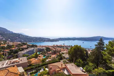 an aerial view of a city and a body of water at LE CALIFORNIA 3 AP4366 By Riviera Holiday Homes in Villefranche-sur-Mer
