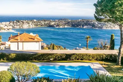 a house with a view of the ocean at LE CALIFORNIA 3 AP4366 By Riviera Holiday Homes in Villefranche-sur-Mer