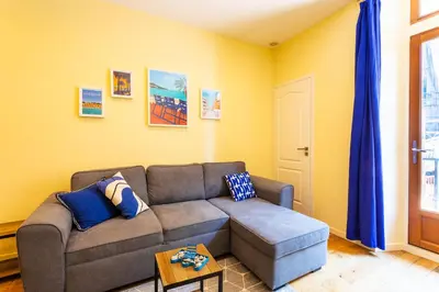 a living room with a couch and a table at LE ST FRANCOIS AP4368 By Riviera Holiday Homes in Nice