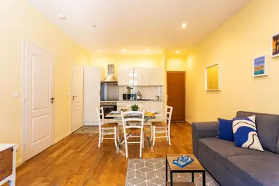 a living room with a couch and a table at LE ST FRANCOIS AP4368 By Riviera Holiday Homes in Nice