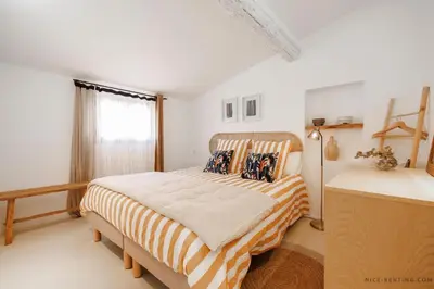 a bedroom with a bed and a window at Nice Renting - NEUVE - Luxury Triplex Old Town Massena Garibaldi - 4 BedRoom - AC in Nice