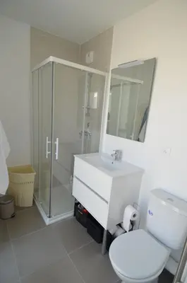 a bathroom with a toilet and a sink and a shower at VILLA SMOLETT - Appartement Cosy au cœur du quartier du port in Nice