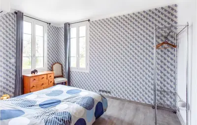 a bedroom with a bed and a shower at Nice Home In Saint-Laurent-Du-Var in Saint-Laurent-du-Var