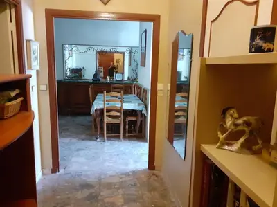 a dining room with a table and a mirror at Nice Fabron 90 m2 avec Garage in Nice