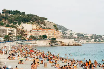 a group of people on a beach in the water at Studio cosy in Nice