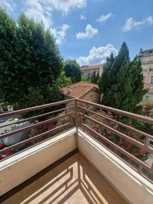 a balcony with a fence and flowers on it at The Chic Libération in Nice