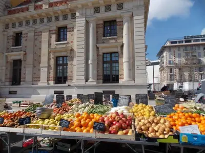 a display of fruits and vegetables in front of a building at The Chic Libération in Nice