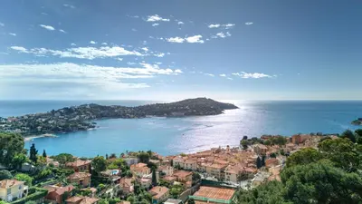 an aerial view of a town and the ocean at Giant Terrace on a stunning View in Villefranche-sur-Mer