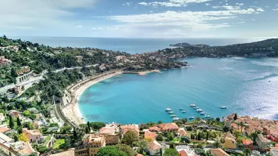 an aerial view of a beach with boats in the water at Giant Terrace on a stunning View in Villefranche-sur-Mer