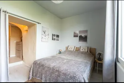 a white bedroom with a bed and a window at Domaine luna estella in Tourrette-Levens