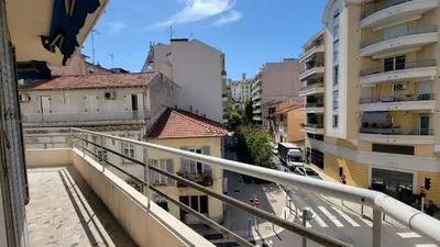 a view of a city street from a balcony at appartement neuf de 3 pieces avec climatisation in Nice