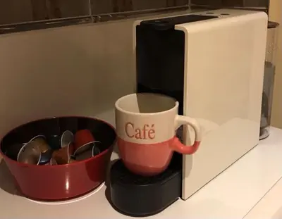 a coffee mug and a cup next to a microwave at Summer Beach Studio, 4 persons, mobile AC, Old Town in Nice