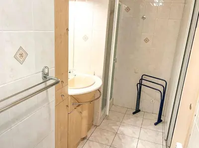 a bathroom with a sink and a shower at Horizon in Saint-Laurent-du-Var