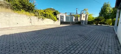 a brick driveway with a gate in front of a house at Joli 3p - Bas de villa in Saint-Andre-de-la-Roche