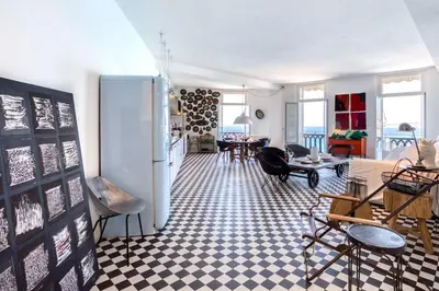 a living room with a refrigerator and a table at L50 2P Rauba Capeu SEA View IloveNice Balcony&AC in Nice