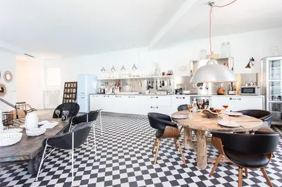 a kitchen with a wooden table and black chairs at L50 2P Rauba Capeu SEA View IloveNice Balcony&AC in Nice