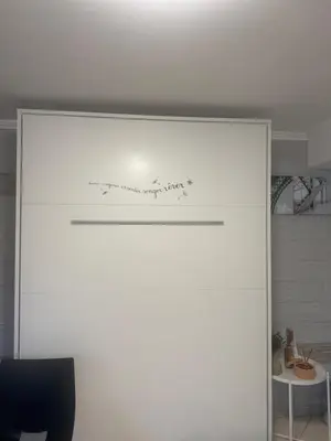 a writing on the top of a door in a room at Studio proche mer avec piscine Cros de cagnes in Cagnes-sur-Mer