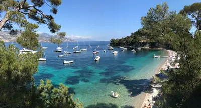 a group of boats in the water on a beach at St JEAN CAP FERRAT CENTRAL CONTEMPORARY LOVELY WIFI in Saint-Jean-Cap-Ferrat