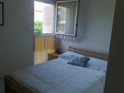 a bedroom with a bed with a window at St JEAN CAP FERRAT CENTRAL CONTEMPORARY LOVELY WIFI in Saint-Jean-Cap-Ferrat