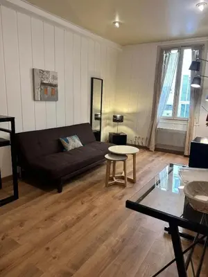 a living room with a couch and a table at MY CASA - BOSIO RAOUL - Central few steps to the sea in Nice