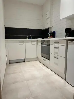 a kitchen with white cabinets and a stove at MY CASA - BOSIO RAOUL - Central few steps to the sea in Nice