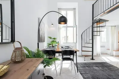 a dining room with a table and some plants at MY CASA - MASSENA 2 - Great location Massena Square with AC in Nice