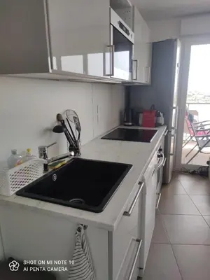 a kitchen with a sink and a counter top at Villa Angela in Nice