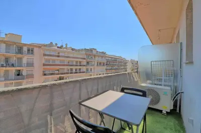 a table and chairs on the balcony of a building at Accès direct Promenade Des Anglais - Negresco in Nice
