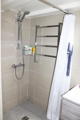 a shower with a shower curtain in a bathroom at Lofty - Massena sq - 5 min walk Beach in Nice