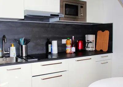 a kitchen counter with a sink and a microwave at Lofty - Massena sq - 5 min walk Beach in Nice