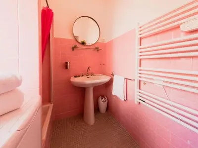 a pink bathroom with a sink and a mirror at Old Town- 4 Pers, Vieux Nice, AC, wifi in Nice