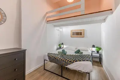 a living room with a blue couch and a table at Vieille Ville - 5 pers, AC, WIFI in Nice