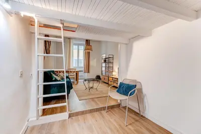 a kitchen with white cabinets and a refrigerator at Vieille Ville - 5 pers, AC, WIFI in Nice