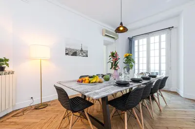 a dining room with a table with fruit on it at FEEL HOME - FOCH 28 in Nice