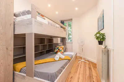 a small bedroom with bunk beds in it at FEEL HOME - FOCH 28 in Nice
