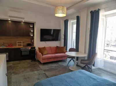 a living room with a couch and a table at Boutique Studio 2 in Nice