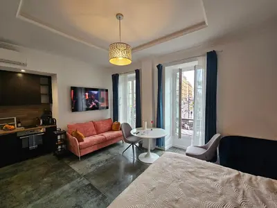 a living room with a couch and a table at Boutique Studio 2 in Nice