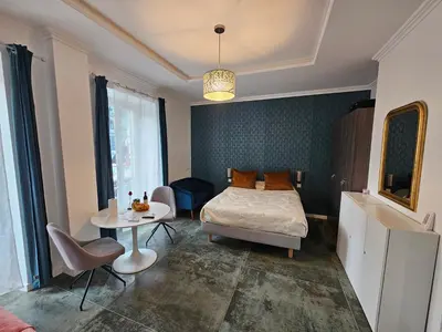 a bedroom with a bed and a table and a tableablish at Boutique Studio 2 in Nice