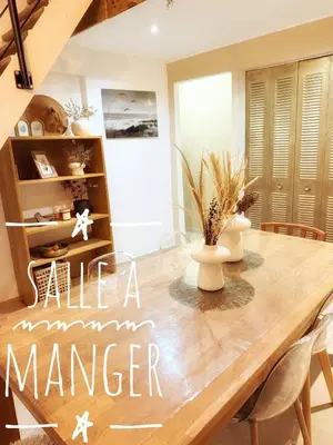 a dining room with a wooden table with flowers on it at Spacious Loft, Duplex, Old Town, 3 bedrooms - EASY CHECK-IN in Nice