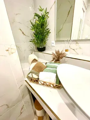 a bathroom with a sink and a mirror at Spacious Loft, Duplex, Old Town, 3 bedrooms - EASY CHECK-IN in Nice